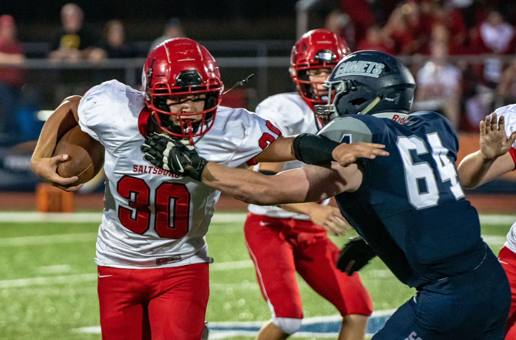 Gazette Photo Gallery: Trojans hold off Comets' late charge